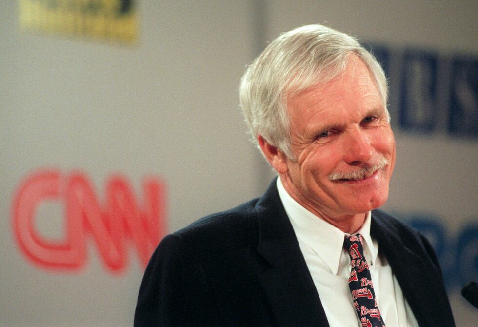 Ted Turner smiles during a special meeting of Turner Broadcasting System shareholders...