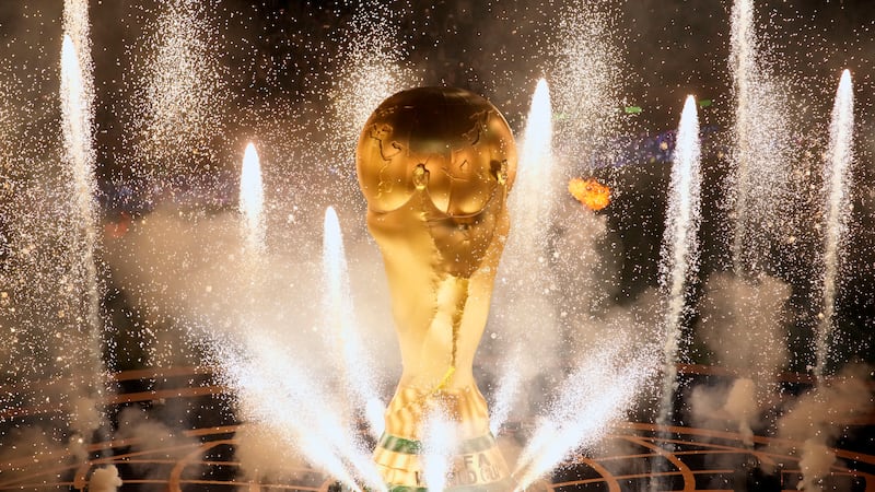 Fireworks go off on the pitch ahead of the World Cup final soccer match between Argentina and...